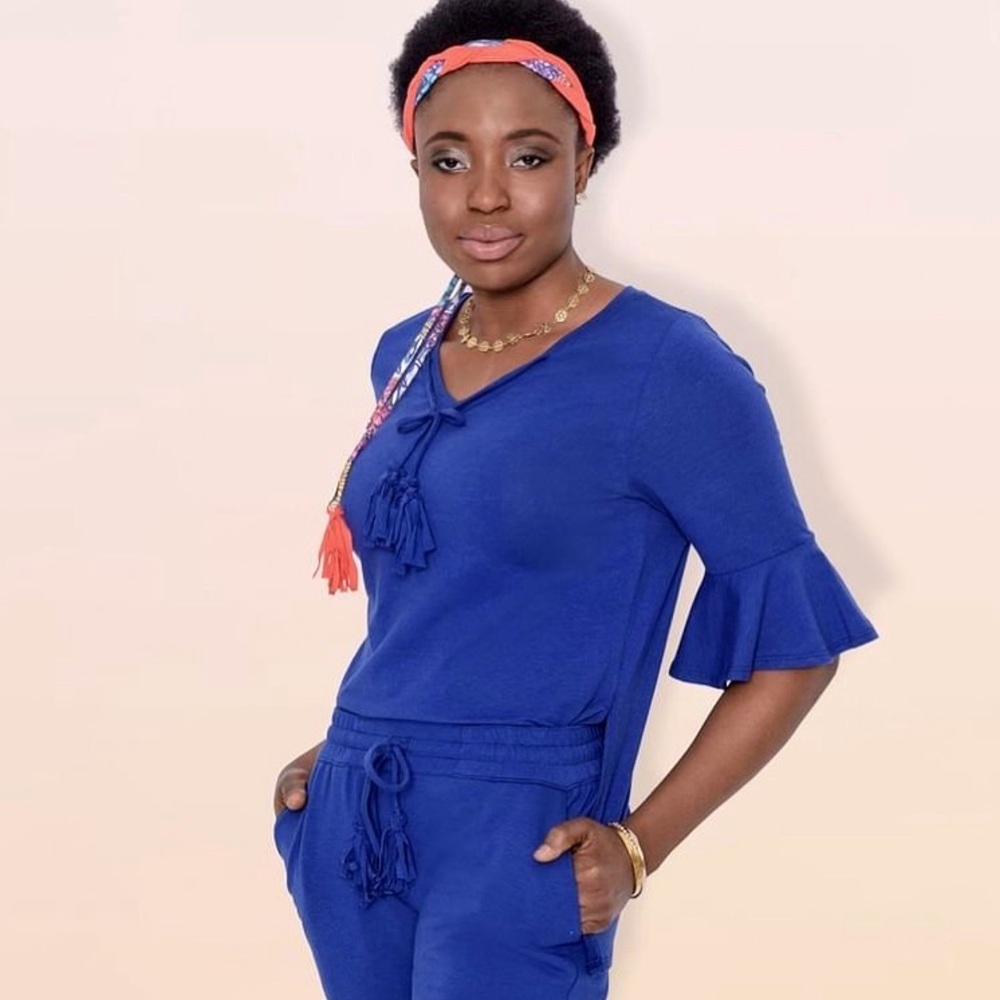Designer tunic top with bell sleeves v-neck and side slit.